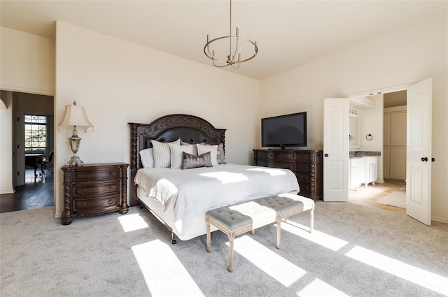 carpeted bedroom featuring a chandelier