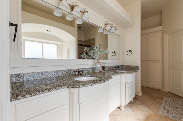 bathroom with tile patterned floors and vanity