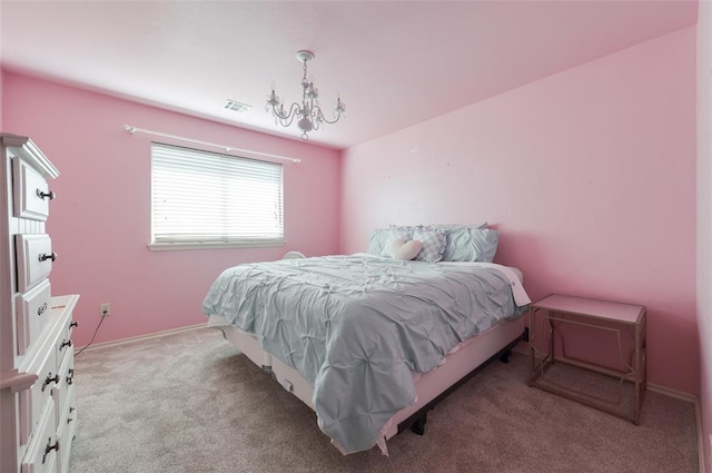 bedroom with light colored carpet and a notable chandelier