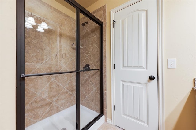 bathroom with a shower with shower door