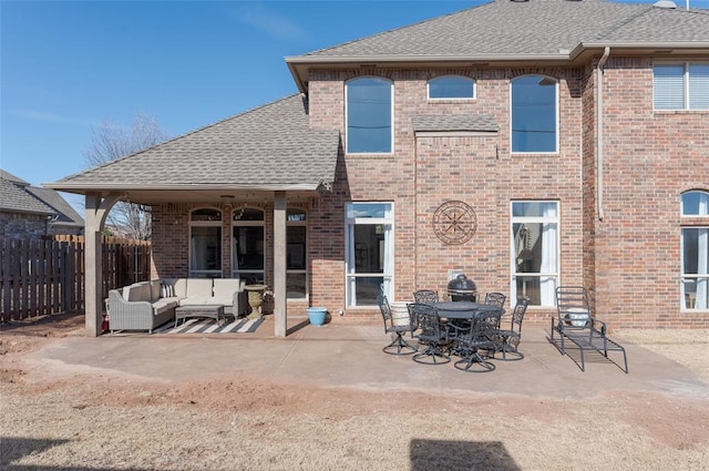 back of house with an outdoor hangout area and a patio area