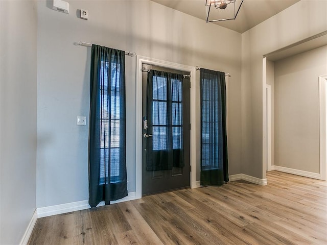 foyer entrance with light hardwood / wood-style floors