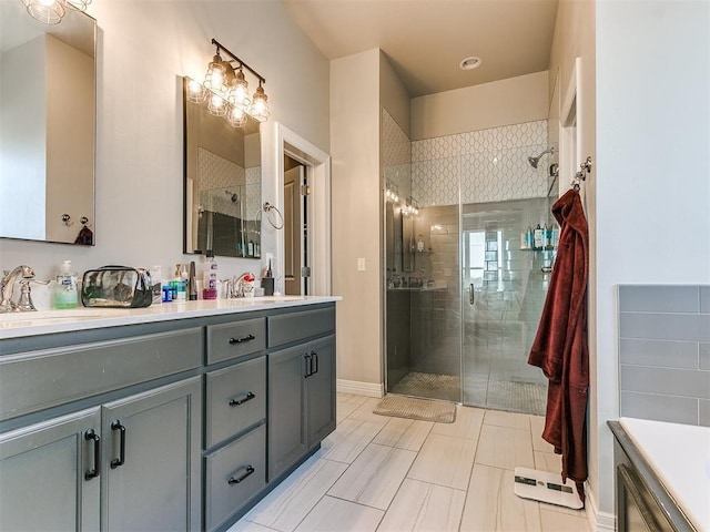 bathroom featuring vanity, tile patterned floors, and a shower with door