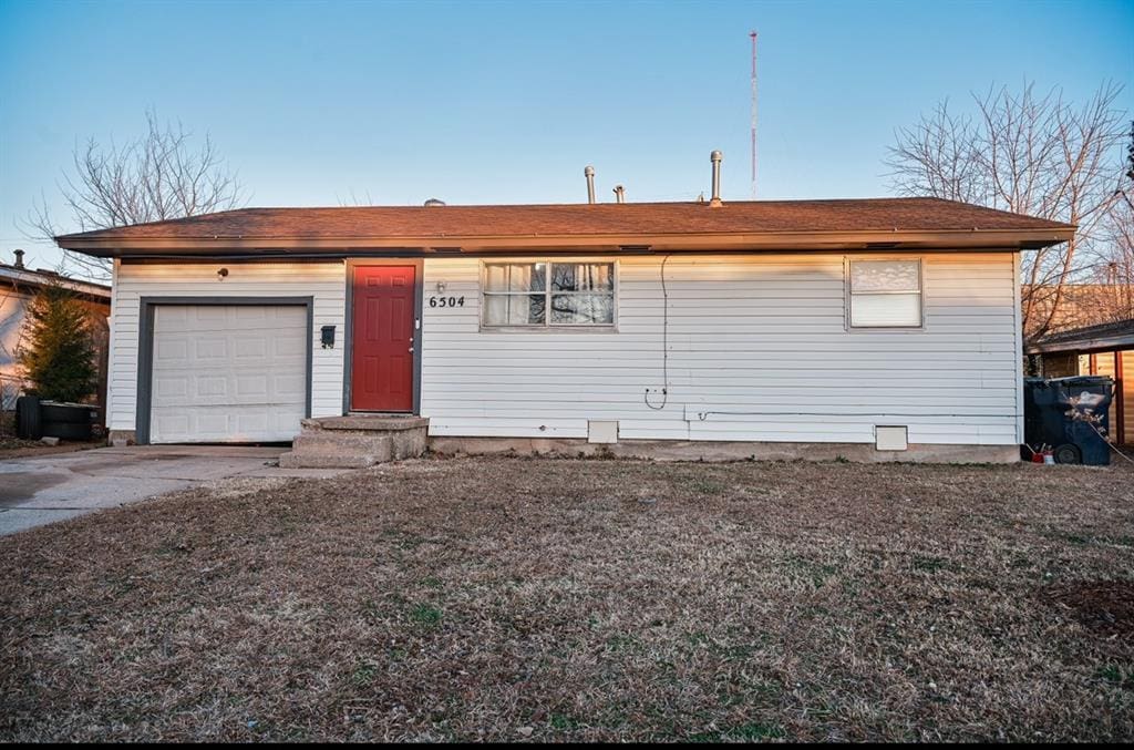 ranch-style house featuring a garage