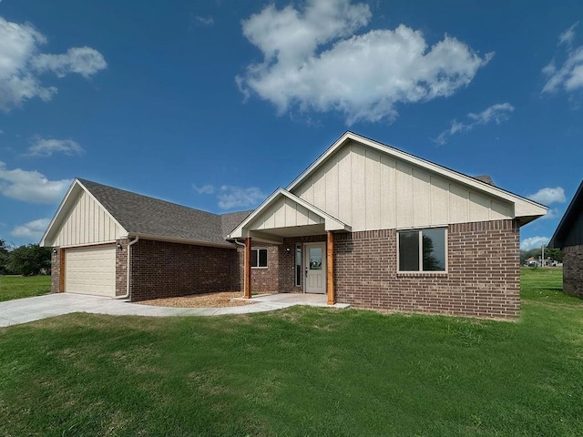 210 S Noble Ave, Hinton, OK 73047 - ranch-style house with brick siding, board and batten siding, a front lawn, and concrete driveway