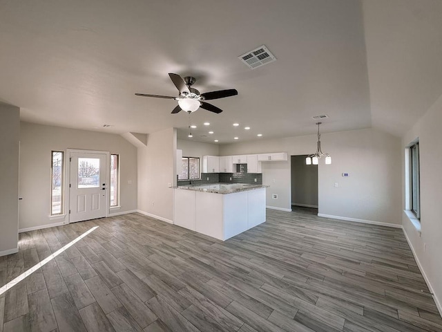 210 S Noble Ave, Hinton, OK 73047 - kitchen featuring white cabinets, baseboards, recessed lighting, and wood finished floors