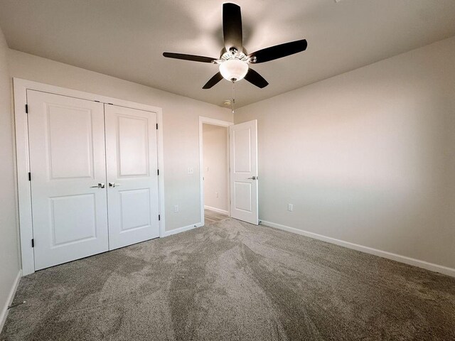 210 S Noble Ave, Hinton, OK 73047 - unfurnished bedroom with carpet flooring, baseboards, a closet, and ceiling fan
