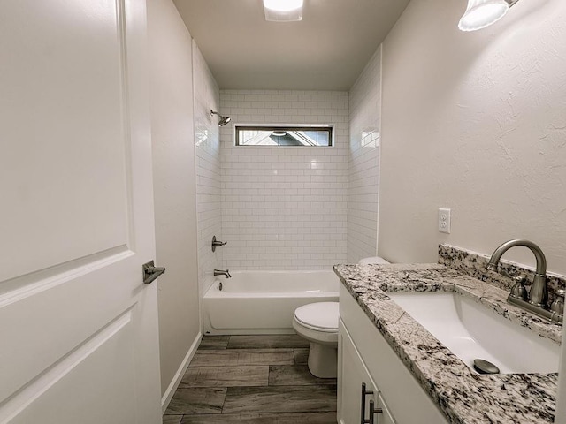 210 S Noble Ave, Hinton, OK 73047 - full bathroom featuring vanity, toilet, tub / shower combination, and wood finished floors