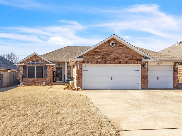 single story home featuring a garage