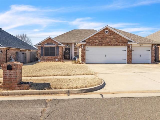 view of front of house featuring a garage, brick siding, a shingled roof, fence, and concrete driveway