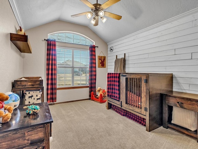 carpeted bedroom featuring ceiling fan, vaulted ceiling, and a textured ceiling