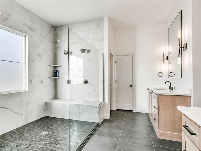 bathroom featuring vanity and a tile shower