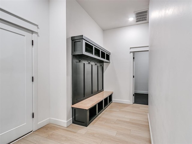 mudroom with light hardwood / wood-style flooring