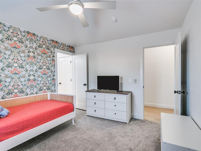 bedroom with ceiling fan and light colored carpet