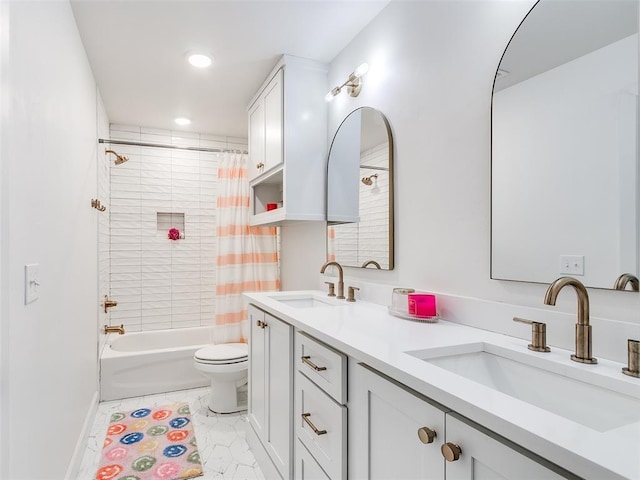 full bathroom with vanity, shower / tub combo, and toilet