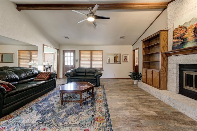 living room featuring ceiling fan, wood-type flooring, a fireplace, and lofted ceiling with beams