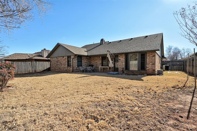 back of house with cooling unit and a patio area