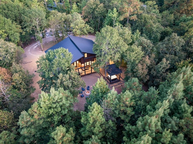 birds eye view of property with a forest view