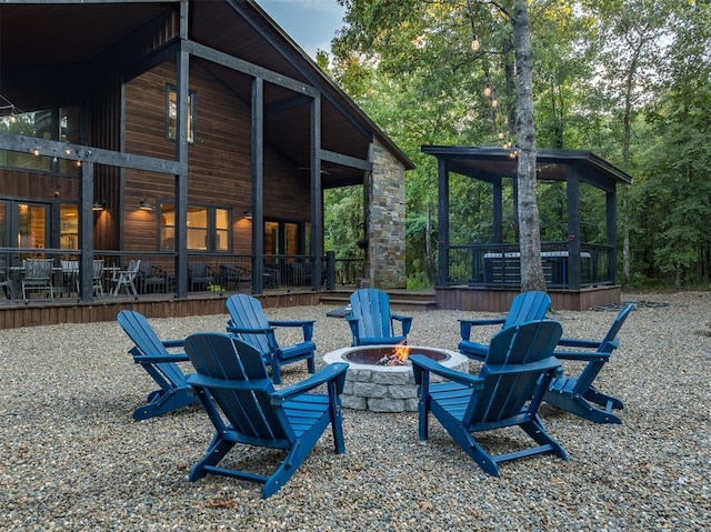 view of yard with a fire pit and a wooden deck