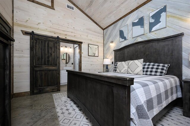 65 Rocky Rose Cir, Broken Bow, OK 74728 - bedroom featuring wooden walls, lofted ceiling, wooden ceiling, a barn door, and concrete flooring