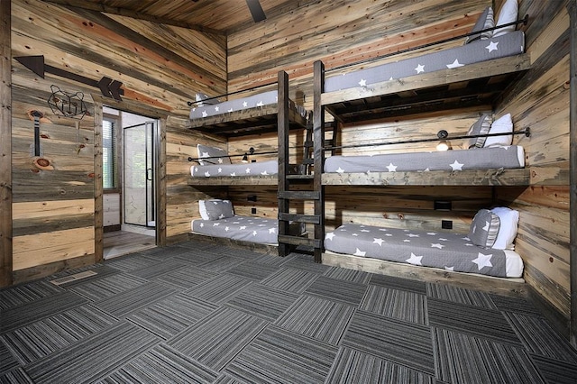 65 Rocky Rose Cir, Broken Bow, OK 74728 - unfurnished bedroom featuring wood walls and carpet flooring