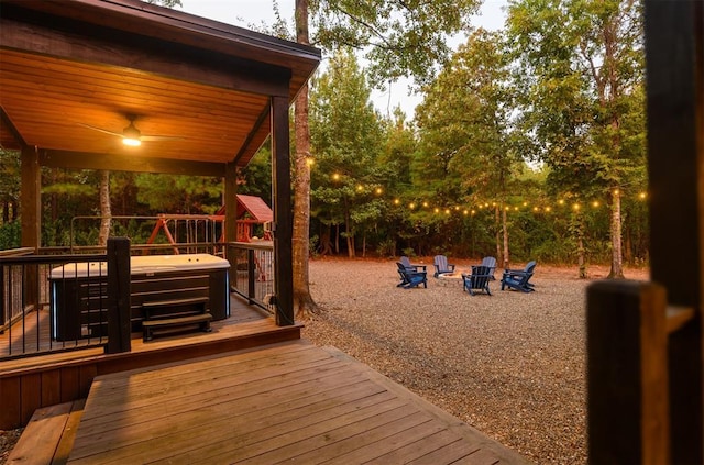 65 Rocky Rose Cir, Broken Bow, OK 74728 - wooden deck featuring a fire pit and a jacuzzi