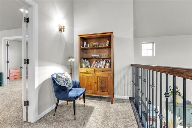 sitting room with carpet floors