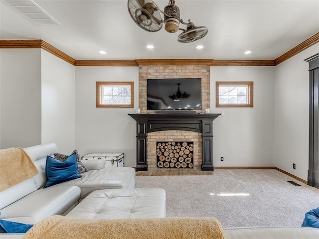 carpeted living room featuring ornamental molding, a brick fireplace, and a healthy amount of sunlight