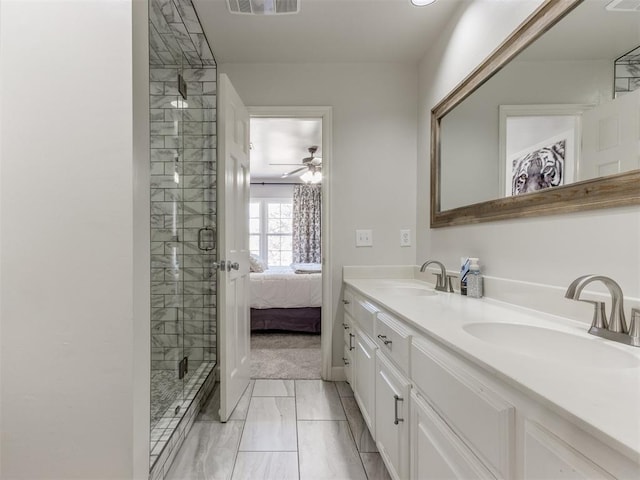 bathroom featuring vanity, ceiling fan, and a shower with shower door