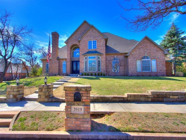 view of front of home with a front lawn