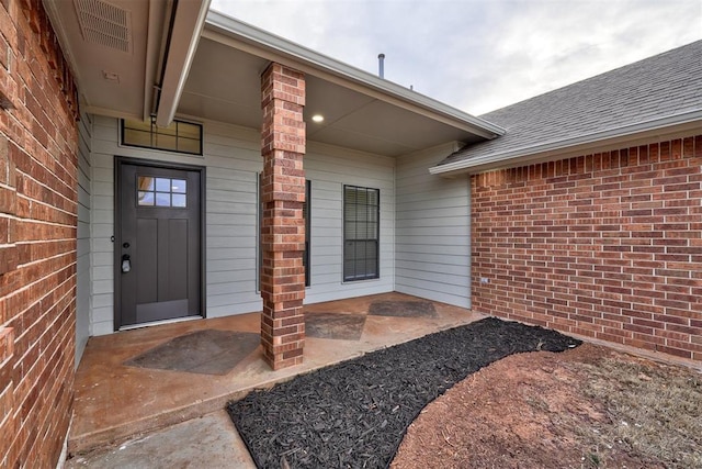 doorway to property featuring a patio area