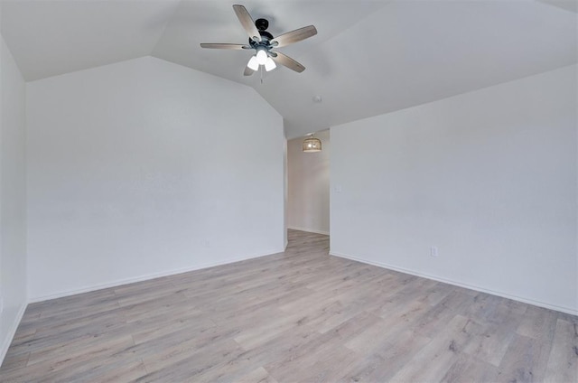 interior space featuring light hardwood / wood-style flooring, vaulted ceiling, and ceiling fan