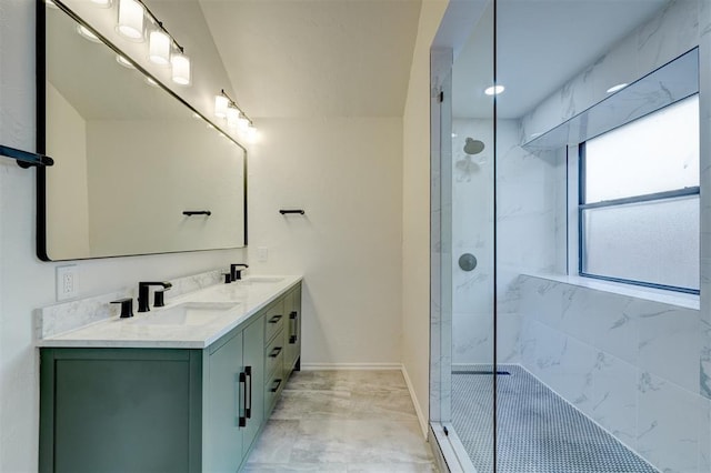 bathroom with vanity and a tile shower