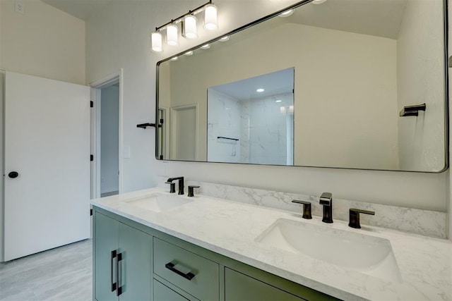 bathroom with vanity and a shower