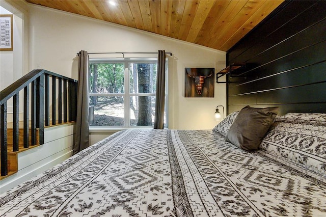 bedroom with vaulted ceiling and wooden ceiling