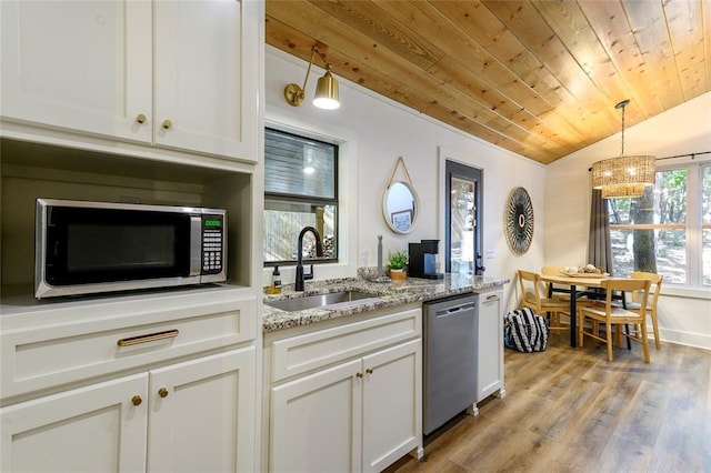 kitchen with sink, white cabinetry, wooden ceiling, stainless steel appliances, and light stone countertops