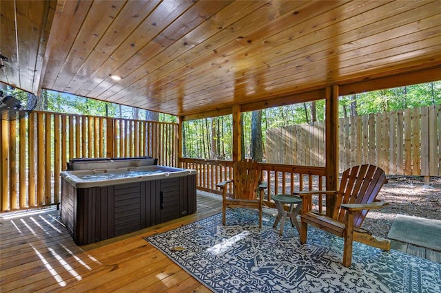 sunroom / solarium with a jacuzzi and wooden ceiling