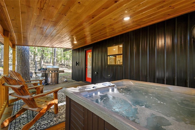 exterior space featuring a grill and a hot tub