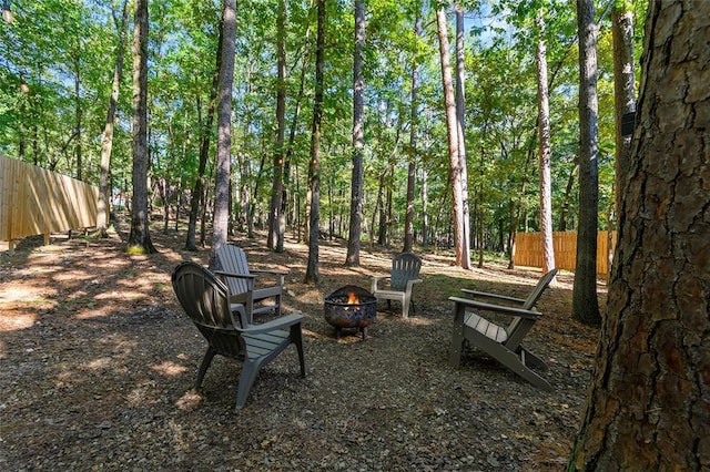 view of yard with an outdoor fire pit