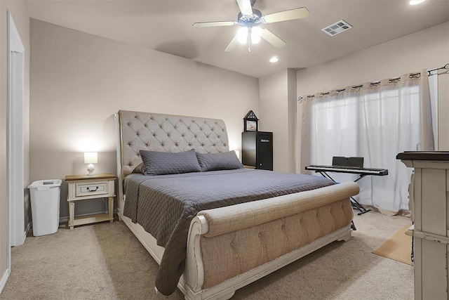 bedroom with light colored carpet and ceiling fan