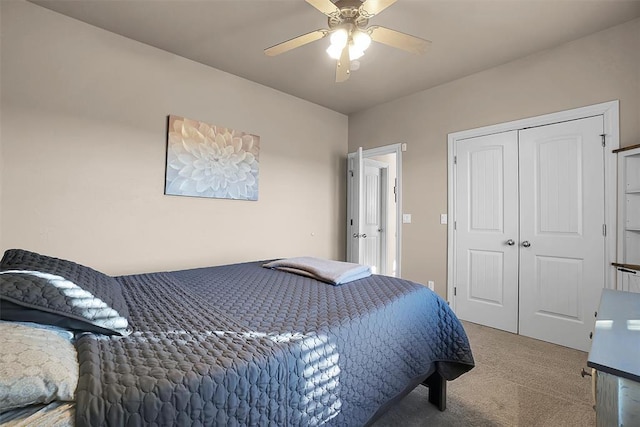 carpeted bedroom with a closet and ceiling fan