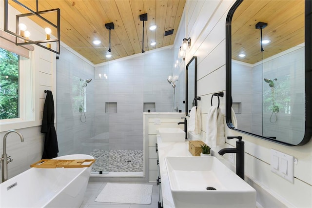 bathroom featuring vaulted ceiling, shower with separate bathtub, plenty of natural light, and wooden ceiling