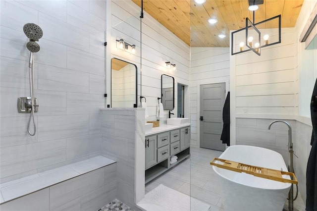 bathroom with lofted ceiling, wood ceiling, wooden walls, vanity, and tile patterned floors