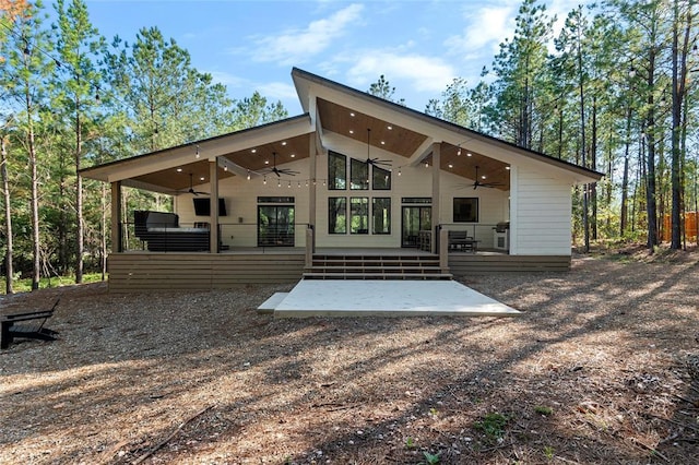 rear view of house with a patio and ceiling fan