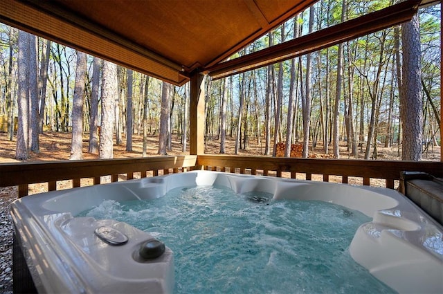 wooden terrace with a hot tub