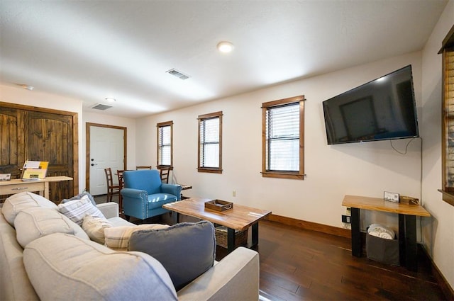 living room with dark hardwood / wood-style flooring