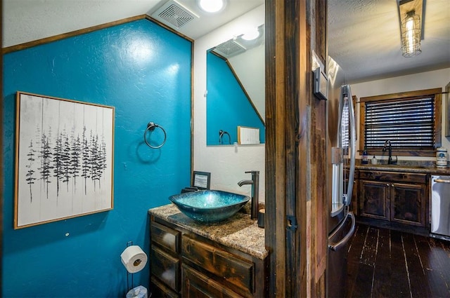 bathroom with vanity and wood-type flooring