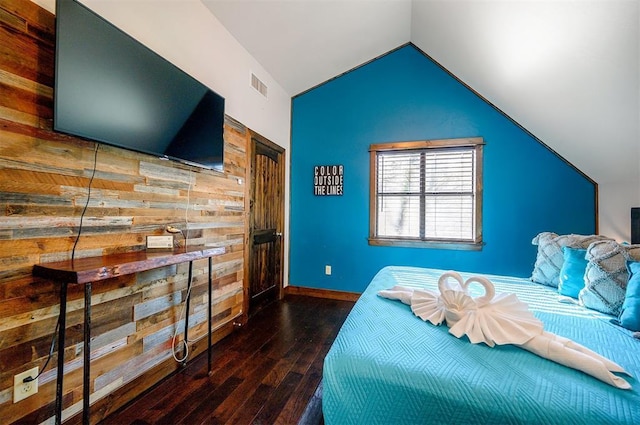 bedroom featuring lofted ceiling and dark wood-type flooring