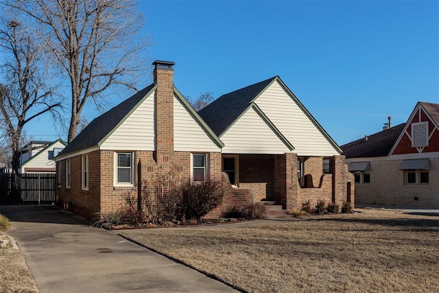 rear view of house featuring a lawn