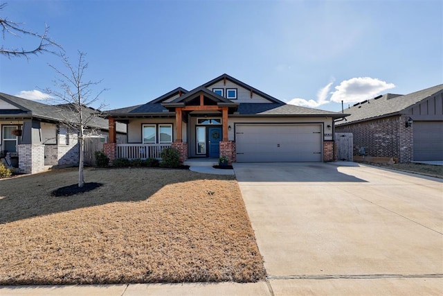 view of front of home with a garage and covered porch